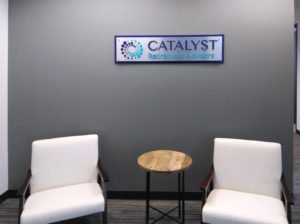 Catalyst reception wall sign
