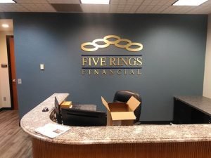 reception area office lobby signs for Five Rings made from gold aluminum