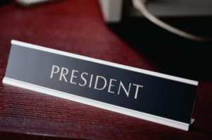 President printed nameplate on the restaurant table.