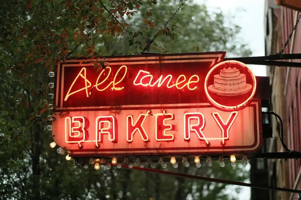 Vintage Neon Bakery Sign in Urban Setting