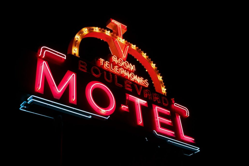 Photo of Red and Orange Motel Neon Signage