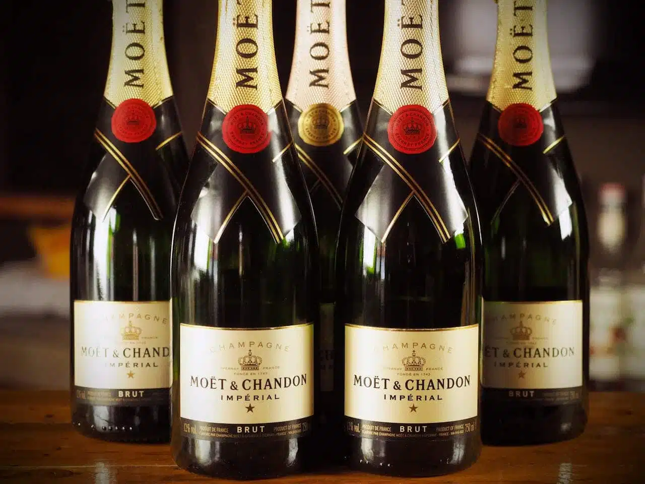 Custom printed BOPP beverage labels on premium champagne bottles designed to withstand moisture and refrigeration.