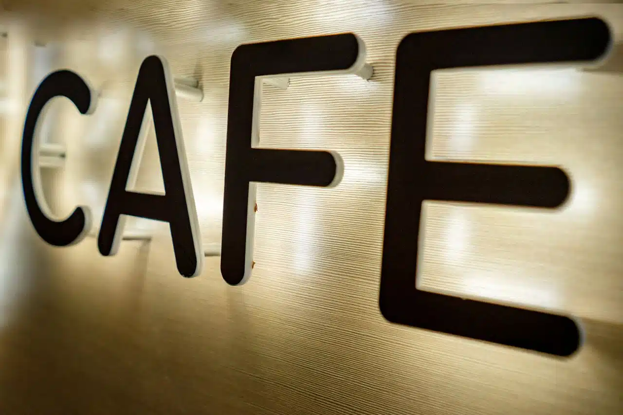 Custom LED backlit channel letters and illuminated business signs manufactured for commercial storefronts.
