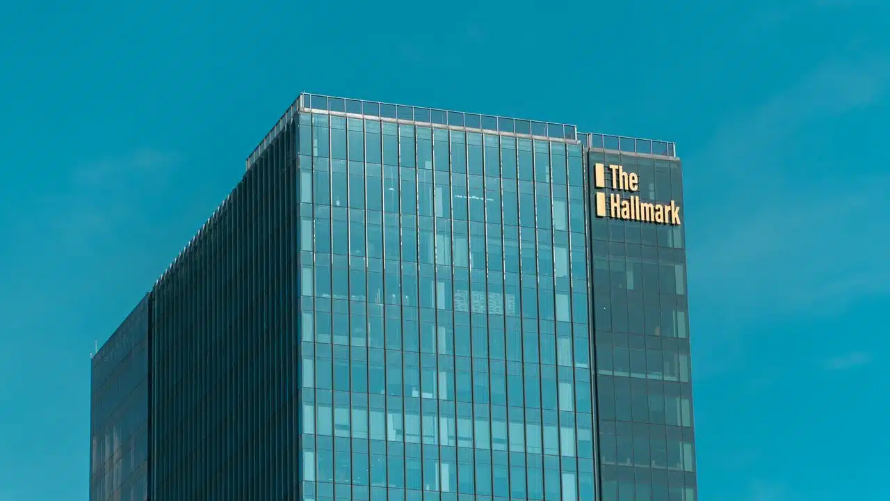 Custom manufactured high-rise building signs and corporate tower facade lettering designed for maximum brand visibility.
